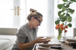 woman-speaking-on-phone-at-home